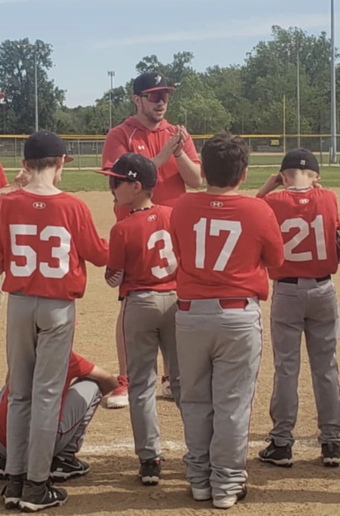 A Southside Prospects coach talking with his team after a game