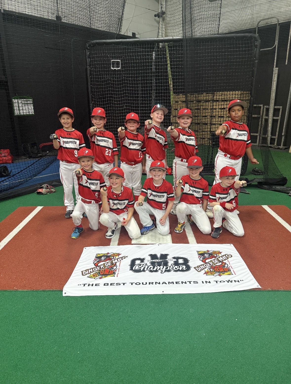 Southside Prospects youth team with a GMB champion banner and rings