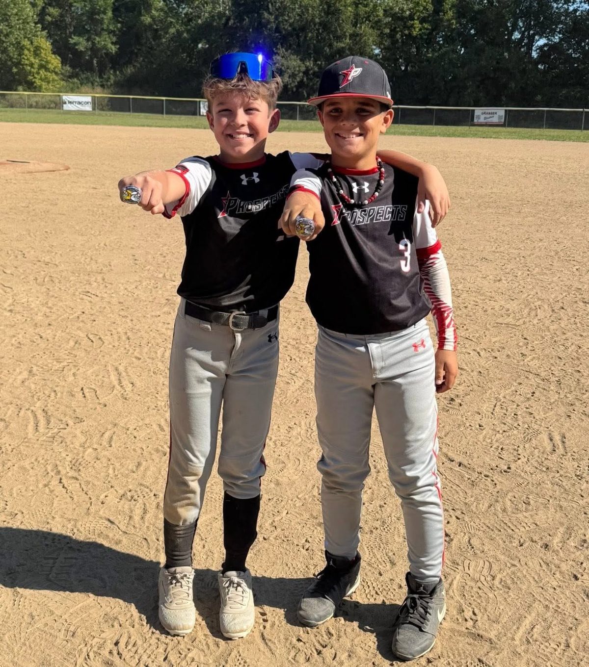 Two Southside Prospects players showing championship rings